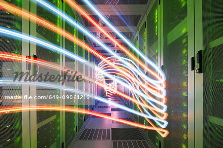 Interior of data centre, lights trails showing travelling data