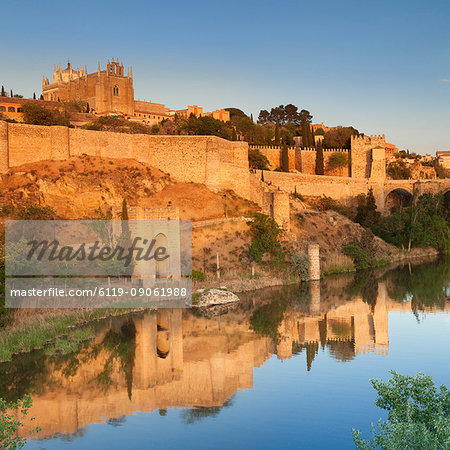 San Juan des los Reyes Monastery and town wall reflected in the Tajo River, Toledo, Castilla-La Mancha, Spain, Europe