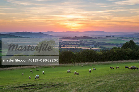 Cotswold landscape and distant Malvern Hills at sunset, Farmcote, Cotswolds, Gloucestershire, England, United Kingdom, Europe Cotswold landscape and distant Malvern Hills at sunset, Farmcote, Cotswolds, Gloucestershire, England, United Kingdom, Europe