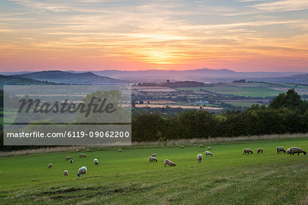 Cotswold landscape and distant Malvern Hills at sunset, Farmcote, Cotswolds, Gloucestershire, England, United Kingdom, Europe