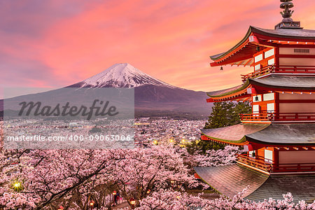 Fujiyoshida, Japan at Chureito Pagoda and Mt. Fuji in the spring with cherry blossoms.