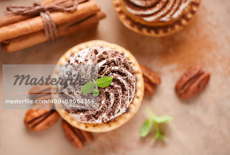 Delicious mini tarts with chocolate cream, top view.