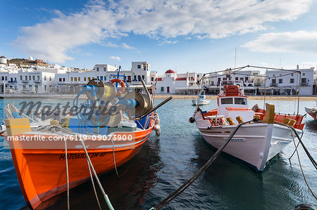 Colourful boats in harbour, whitewashed Mykonos Town (Chora) with windmills and churches, Mykonos, Cyclades, Greek Islands, Greece, Europe