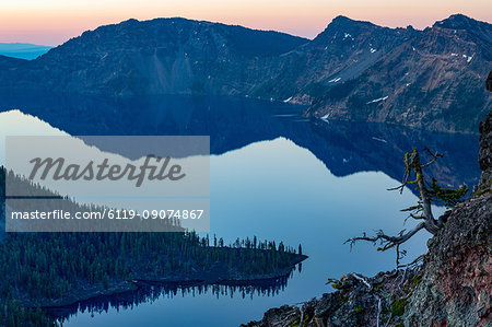 Wizard Island and the still waters of Crater Lake at dawn, the deepest lake in the U.S.A., part of the Cascade Range, Oregon, United States of America, North America