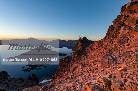 Wizard Island and the still waters of Crater Lake at dawn, the deepest lake in the U.S.A., part of the Cascade Range, Oregon, United States of America, North America