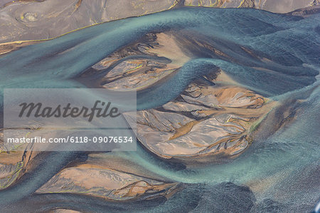 Aerial view of landscape with river coloured by glacial melt.