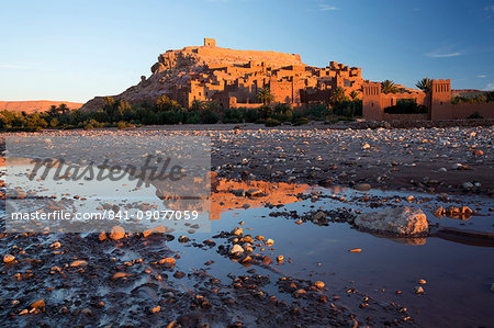 The ancient Kasbah Ait Benhaddou bathed in morning light and reflecting in river, UNESCO World Heritage Site, near Ouarzazate, Morocco, North Africa, Africa