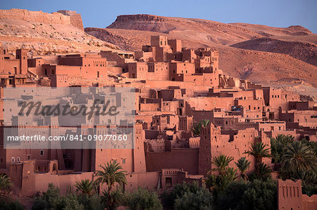 The ancient mud brick buildings of Kasbah Ait Benhaddou bathed in golden morning light, UNESCO World Heritage Site, near Ouarzazate, Morocco, North Africa, Africa