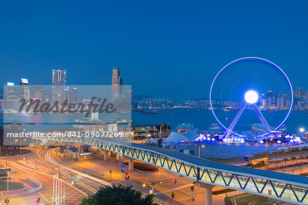 View of Star Ferry pier, observation wheel and Tsim Sha Tsui skyline, Central, Hong Kong, China, Asia View of Star Ferry pier, observation wheel and Tsim Sha Tsui skyline, Central, Hong Kong, China, Asia