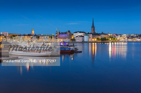 View of Riddarholmen and Sodermalm at dusk from near Town Hall, Stockholm, Sweden, Scandinavia, Europe