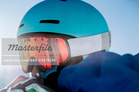 Portrait of skier, wearing ski goggles, close-up