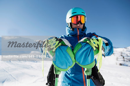 Portrait of skier in snow, front view