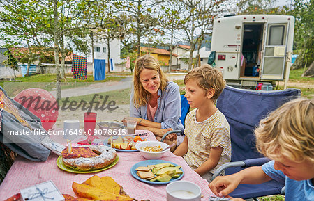 Family at picnic table celebrating boys birthday, Florianopolis, Santa Catarina, Brazil, South America