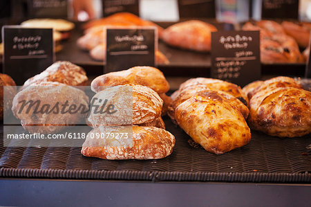 Close up of selection of freshly baked rolls in a bakery.