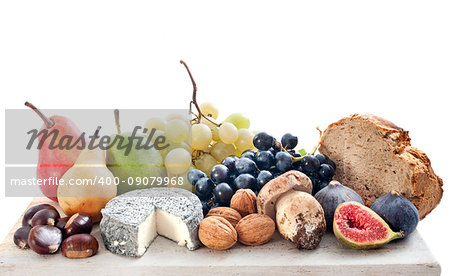 fruits and cheese in front of white background