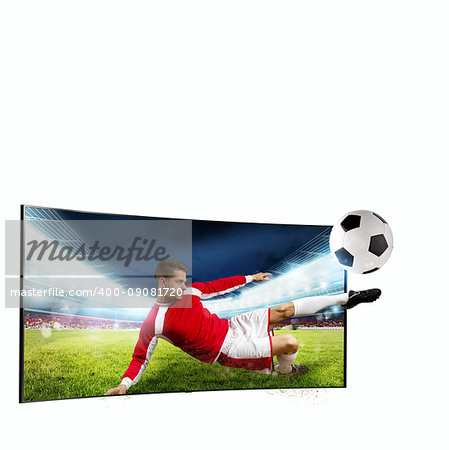 Soccer player comes out of the tv to kick the ball