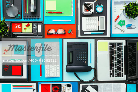 Full tidy business desktop with laptop, telephone, paperwork and office accessories, business and creativity concept, flat lay