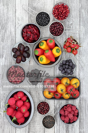 Healthy super food selection of fruit, pulses, vegetables and grains high in anthocyanins, antioxidants and vitamins. Health promoting foods concept. Top view.