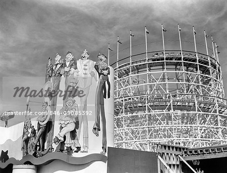 1930s 1939 WORLD'S FAIR CLOWN MURAL AND ROLLER COASTER IN AMUSEMENT AREA NEW YORK CITY NY USA