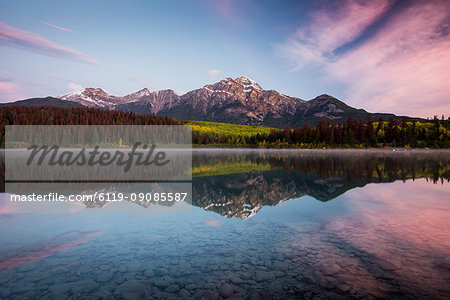 Pyramid Mountain reflected in Patricia Lake in autumn at sunrise, Jasper National Park, UNESCO World Heritage Site, Canadian Rockies, Alberta, Canada, North America