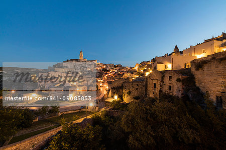 Dusk on the ancient town and historical center called Sassi, perched on rocks on top of hill, Matera, Basilicata, Italy, Europe