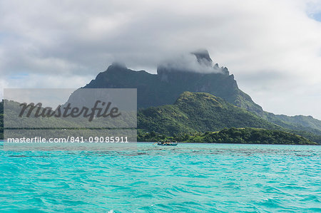 The volcanic rock in the turquoise lagoon of Bora Bora, Society Islands, French Polynesia, Pacific