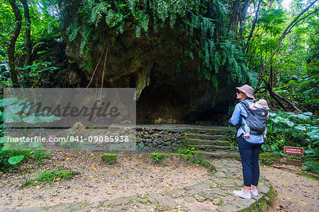 Woman with a baby hiking in the Sacred site of Sefa Utaki, UNESCO World Heritage Site, Okinawa, Japan, Asia