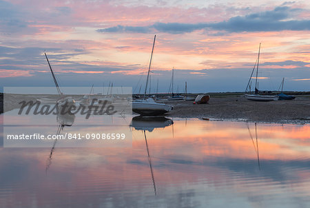 Sunset over the tidal channel at Brancaster Staithe, Norfolk, England, United Kingdom, Europe