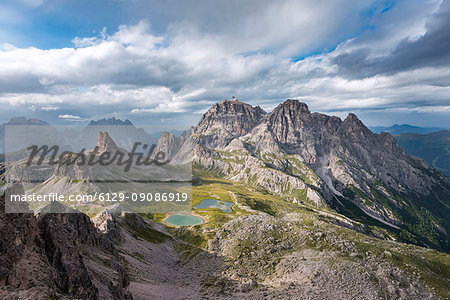 Sesto / Sexten, province of Bolzano, Dolomites, South Tyrol, Italy. Zhe sunrays after the thunderstorm illuminate the lakes Piani Sesto / Sexten, province of Bolzano, Dolomites, South Tyrol, Italy. Zhe sunrays after the thunderstorm illuminate the lakes Piani