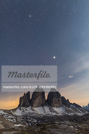 Stars above rocky peaks of Tre Cime Di Lavaredo (Drei Zinnen), Sexten Dolomites, South Tyrol, province of Bolzano, Italy