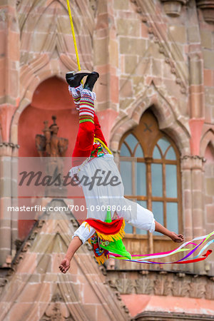 Close-up of the Danza de los Voladores (Dance of the Flyers) or Palo Volador (pole flying) by the Totonac tribe performing in front of the Parroquia de San Miguel Arcangel at the St Michael Archangel Festival in San Miguel de Allende, Mexico