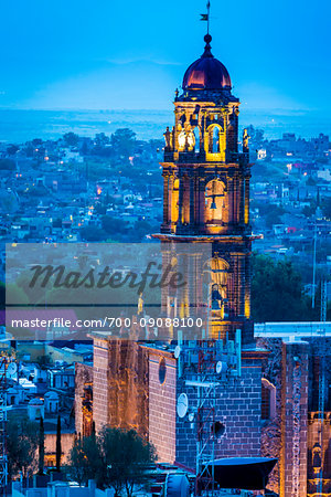 The 18 century Church of San Francisco (formerly the Convent of San Antonio) with prominent bell tower at dusk in San Miguel de Allende, Mexico