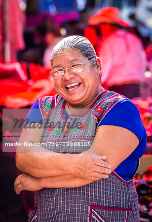 Portrait of smiling, female vendor at the Tianguis de los Martes (Tuesday Market) in San Miguel de Allende, Mexico