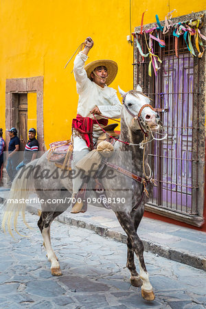 Mexican man on horse re-enacting rebelion during the historic horseback parade celebrating Mexican Independence Day in San Miguel de Allende, Mexico