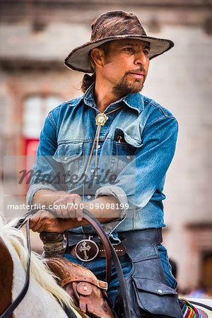 Mexican man on horseback participating in the historic horseback parade celebrating Mexican Independence Day, San Miguel de Allende, Mexico.