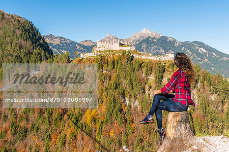 Reutte, Tyrol, Austria, Europe. Ehrenberg Castle and the Highline 179, the world's longest pedestrian suspension bridge. A young woman admiring the view