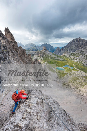 Sesto / Sexten, province of Bolzano, Dolomites, South Tyrol, Italy. Climber on the via ferrata "De Luca-Innerkofler" to the Mount Paterno