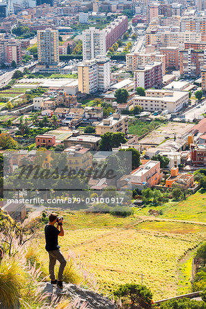 Tourist while portraying Palermo Europe, Italy, Sicily region, Palermo district, Palermo city, Pellegrino mountain