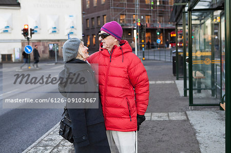 Senior couple waiting at bus stop