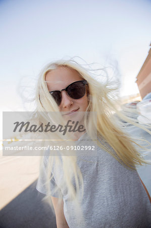 Portrait of blonde girl wearing sunglasses
