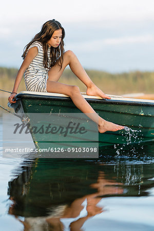 Portrait of girl sitting on boat