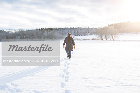 Woman walking in snow