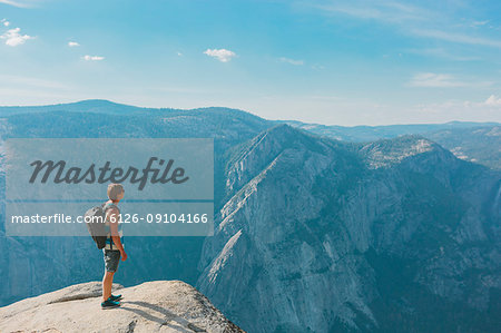 Man standing at Taft Point in Yosemite National Park