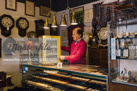 Man at counter in antique store in Sweden