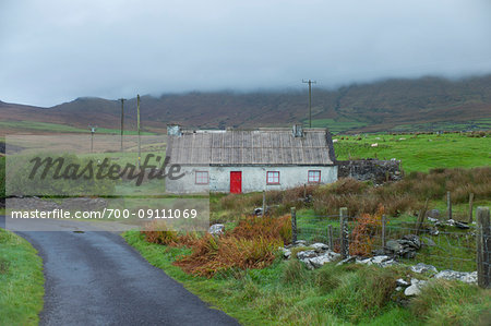 Typical cottage along the road in the Irish countryside on a foggy day in the Wicklow Mountians in Leinster Province, Ireland