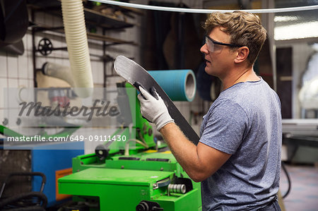 Man in workshop, making ski equipment