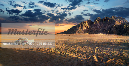 Sandy field in desert of Egypt at sunset