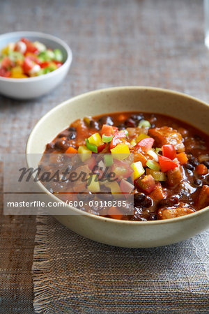 Chili with peppers in bowl