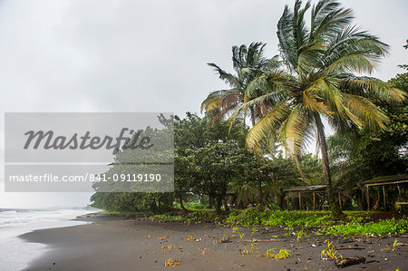 Black volcanic sand on six mile beach near Limbe, southern Cameroon, Africa