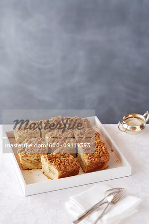 Crumble coffee cake on a white serving tray
